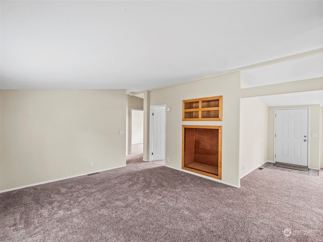 unfurnished living room featuring carpet