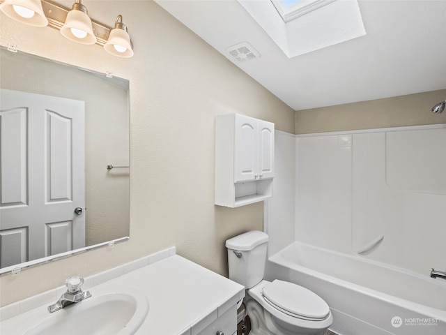 full bathroom featuring vanity, vaulted ceiling with skylight, toilet, and shower / bathtub combination