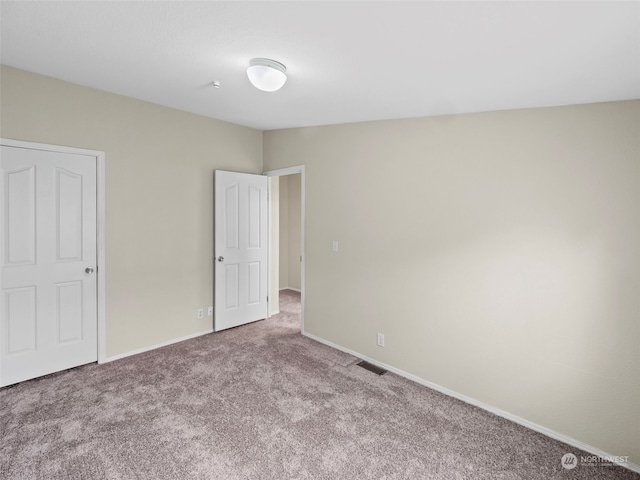 unfurnished room with carpet floors