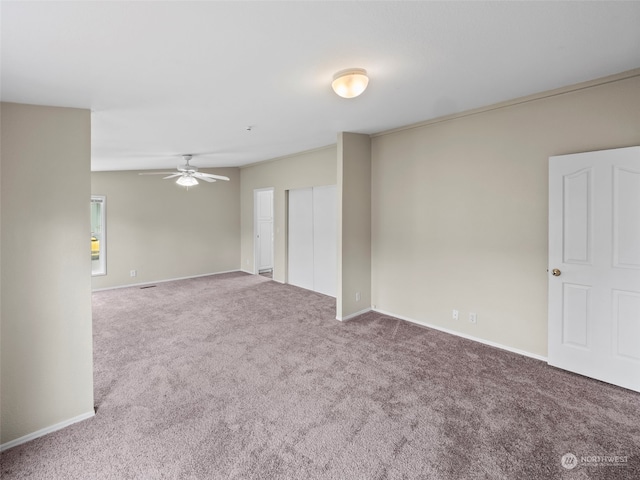 unfurnished room featuring carpet flooring and ceiling fan