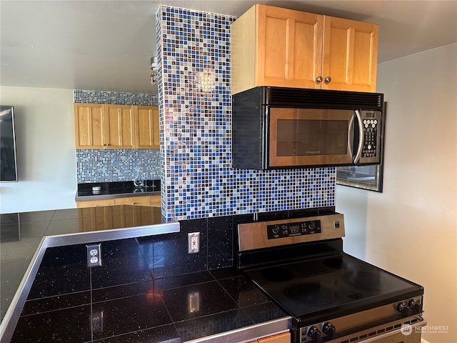 kitchen with decorative backsplash, tile countertops, stove, and light brown cabinets