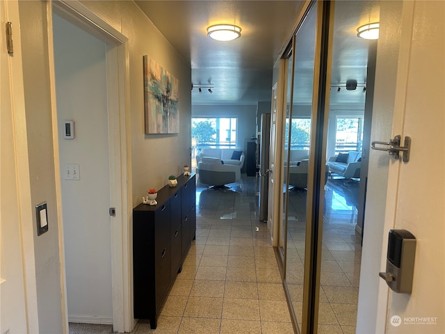 hallway featuring light tile patterned floors