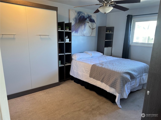 carpeted bedroom with ceiling fan