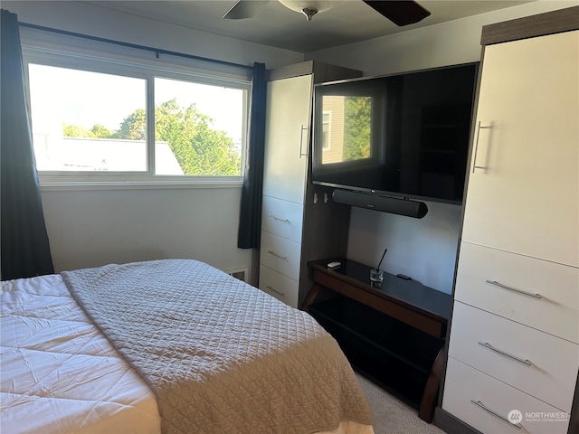 carpeted bedroom featuring ceiling fan