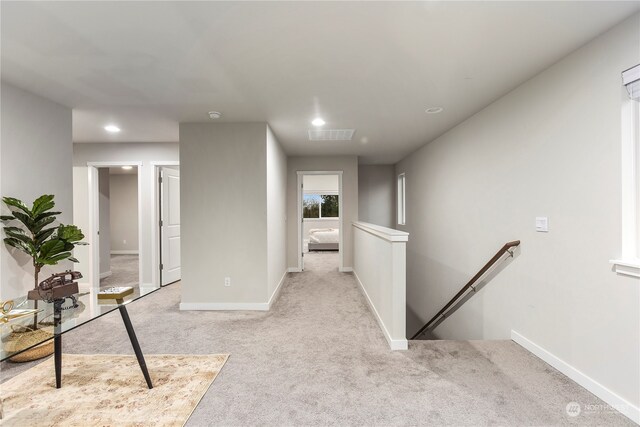 hallway with light carpet