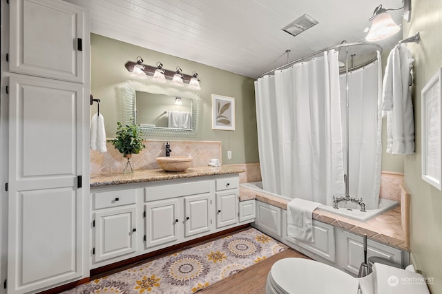 full bathroom featuring vanity, toilet, wood-type flooring, and backsplash