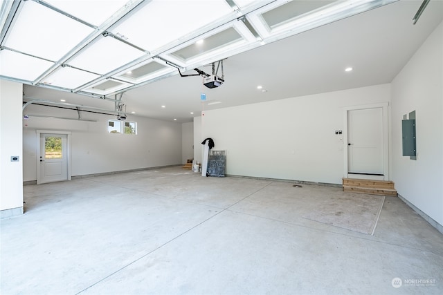 garage featuring a garage door opener and electric panel