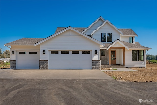 view of front of home with a garage and a porch