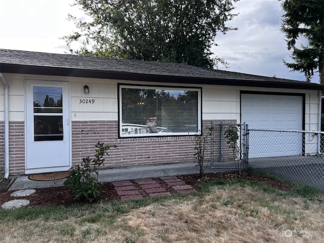 single story home featuring a garage