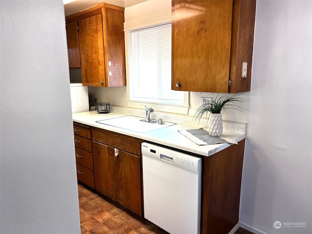 kitchen with white dishwasher and sink