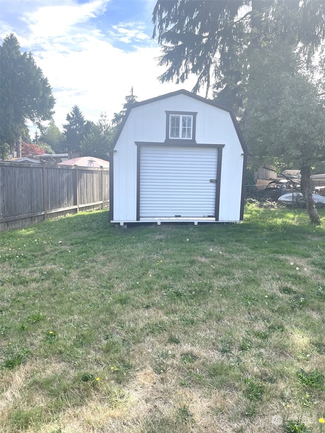 garage featuring a lawn