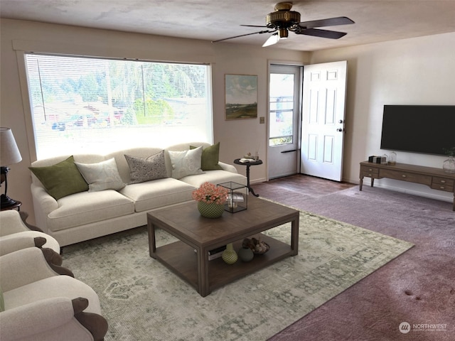 carpeted living room with ceiling fan and a healthy amount of sunlight