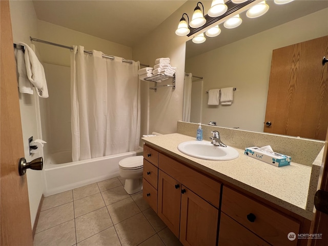 full bathroom featuring tile patterned floors, shower / bath combination with curtain, toilet, and vanity