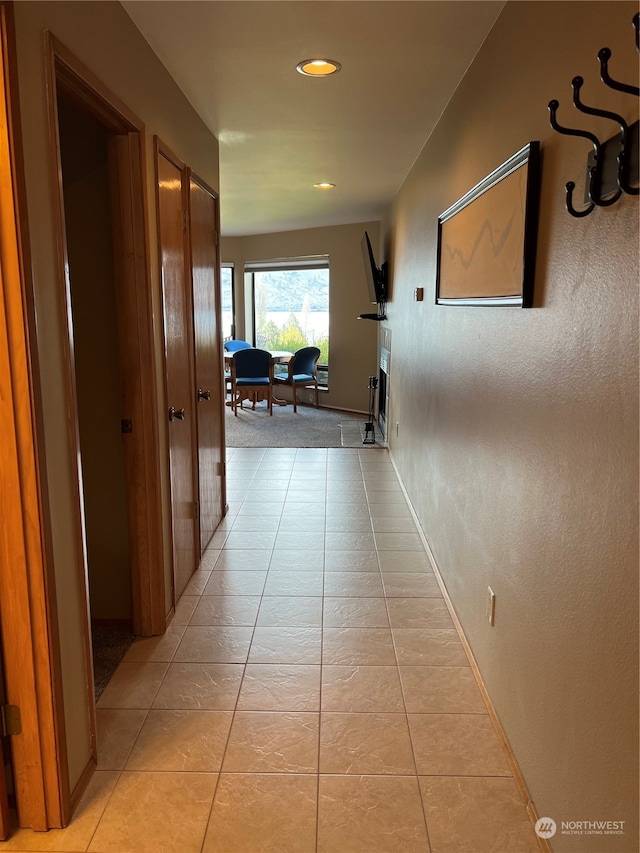 hallway with light tile patterned flooring