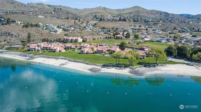 bird's eye view with a water and mountain view and a beach view