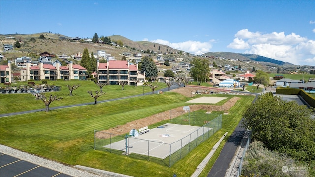 birds eye view of property featuring a mountain view