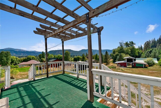 view of patio featuring a mountain view and a pergola