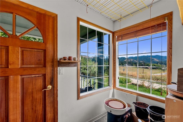 interior space with a healthy amount of sunlight and a mountain view