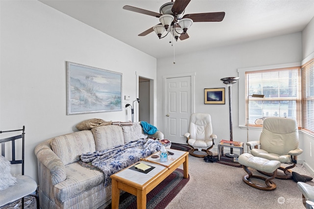 carpeted living room featuring ceiling fan