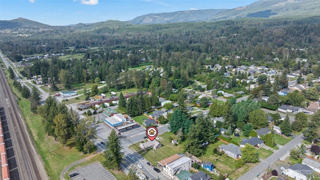 drone / aerial view featuring a mountain view