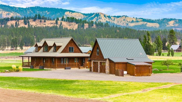 view of front of property featuring a mountain view and a porch