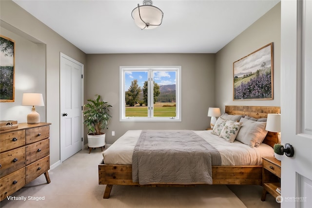 bedroom featuring light colored carpet