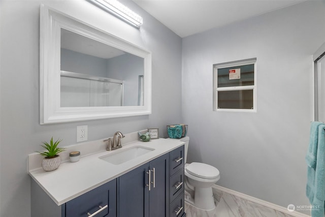 full bathroom with a shower with door, baseboards, toilet, marble finish floor, and vanity