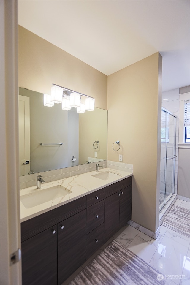 bathroom with vanity and a shower with shower door