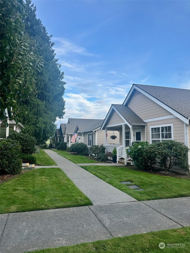 view of front facade with a porch and a front yard