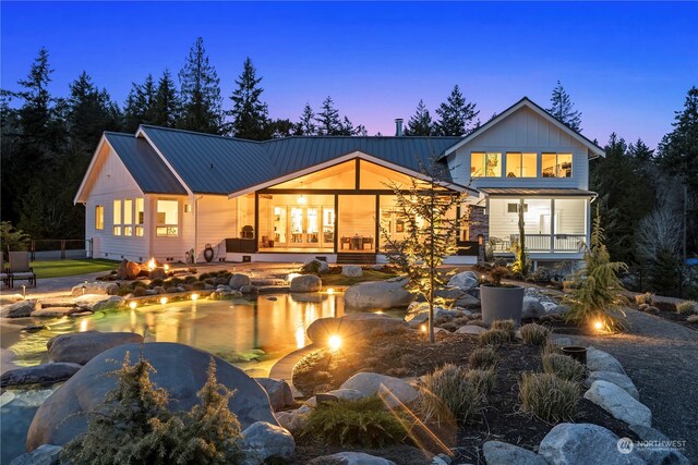 back house at dusk with french doors