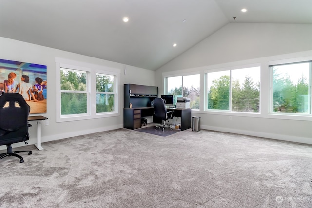 carpeted office featuring high vaulted ceiling and a wealth of natural light