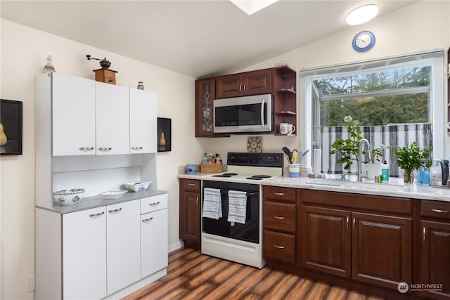 kitchen featuring dark brown cabinets, white electric stove, sink, dark hardwood / wood-style floors, and vaulted ceiling