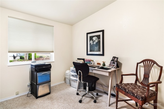 office with light carpet and vaulted ceiling