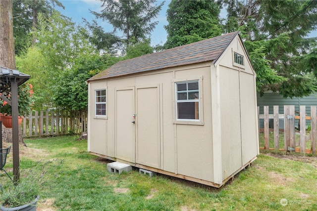 view of outdoor structure with a lawn