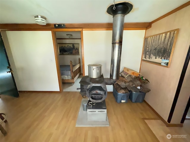 interior space with hardwood / wood-style floors and a wood stove