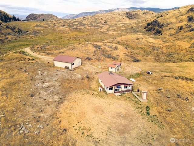 bird's eye view featuring a rural view and a mountain view