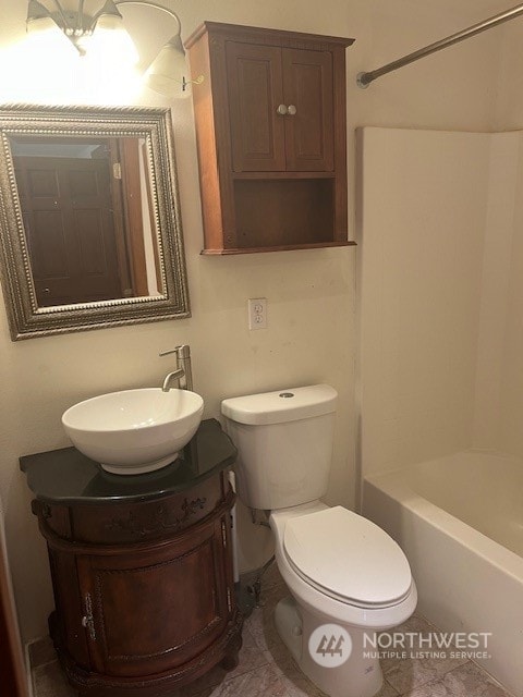 full bathroom with vanity, toilet, and bathtub / shower combination