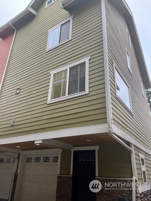 view of property exterior featuring a garage