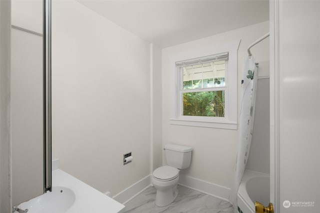 bathroom with toilet and shower / tub combo with curtain