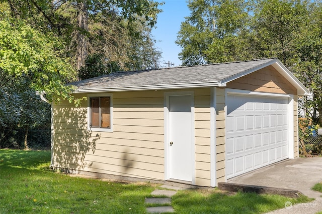 garage featuring a lawn