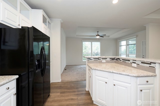 191 E Greenwood Ln, Shelton, WA 98584 - kitchen featuring black refrigerator with ice dispenser, a raised ceiling, a ceiling fan, dark wood finished floors, and white cabinetry