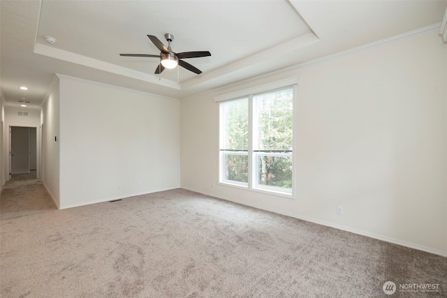 191 E Greenwood Ln, Shelton, WA 98584 - spare room featuring a raised ceiling, carpet flooring, a ceiling fan, baseboards, and crown molding