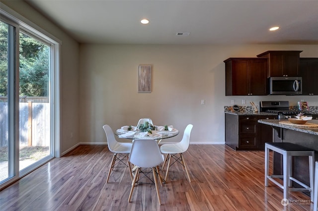 dining room featuring wood-type flooring