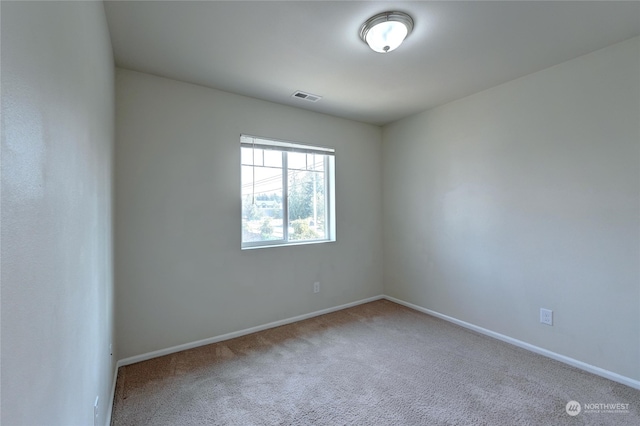 unfurnished room featuring carpet