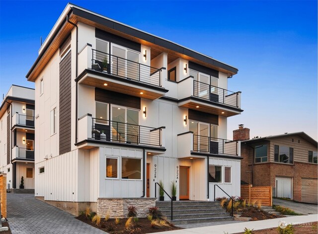 exterior space featuring a garage and a balcony