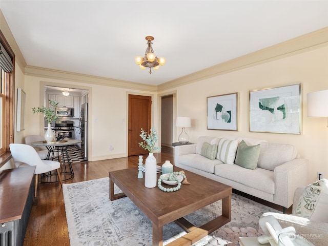 living room featuring crown molding, a notable chandelier, and dark hardwood / wood-style floors