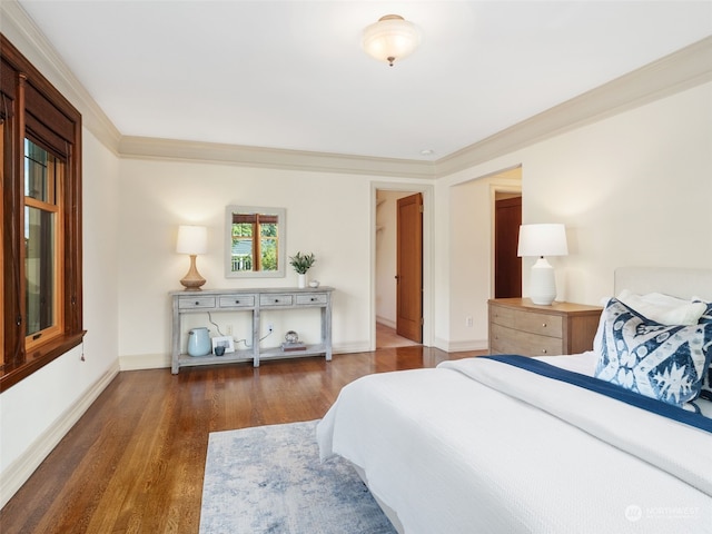 bedroom featuring dark wood-type flooring and ornamental molding