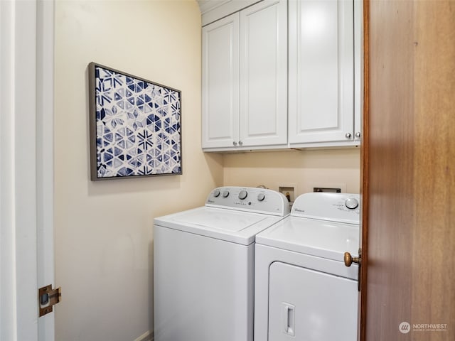 laundry room with cabinets and separate washer and dryer