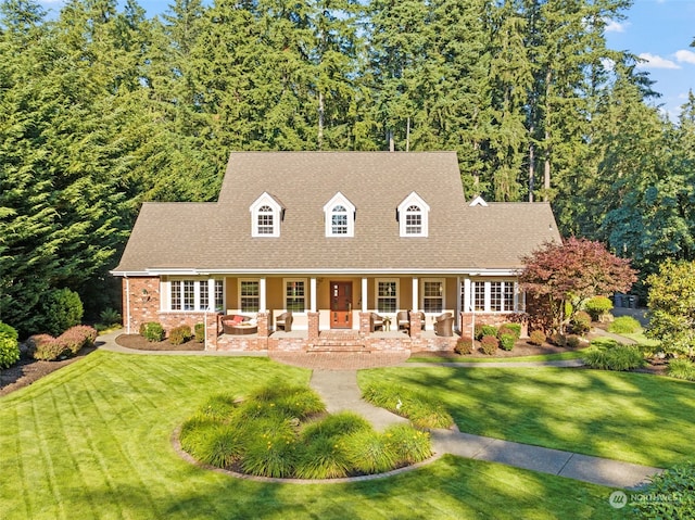 new england style home with an outdoor hangout area and a front lawn