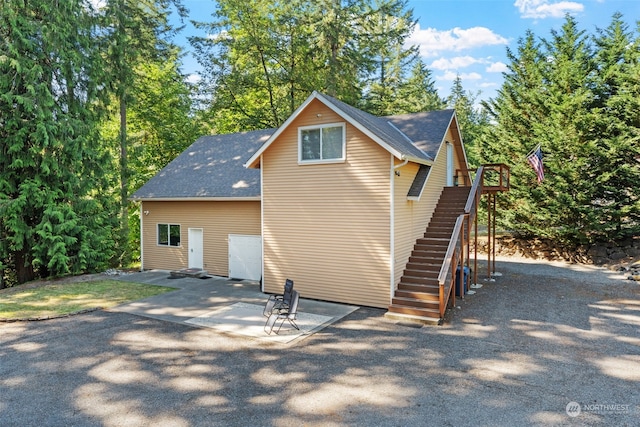 rear view of house with a patio